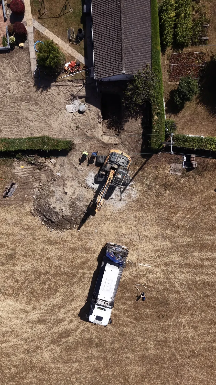 Overhead view of groundworks beside a house and garden