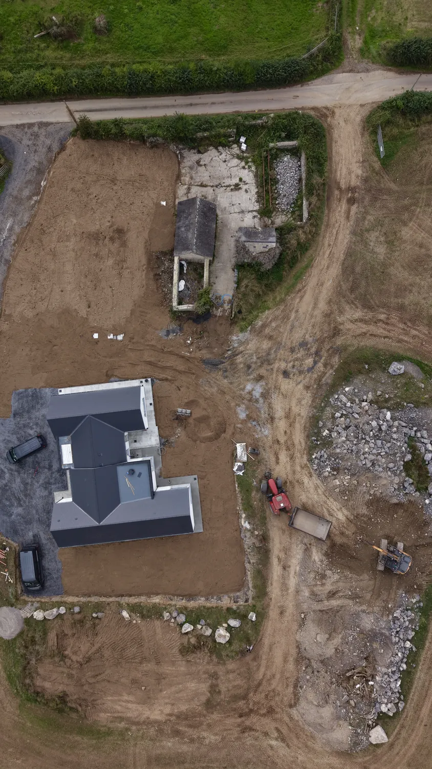 Top-down view of excavation and landscaping works around a house