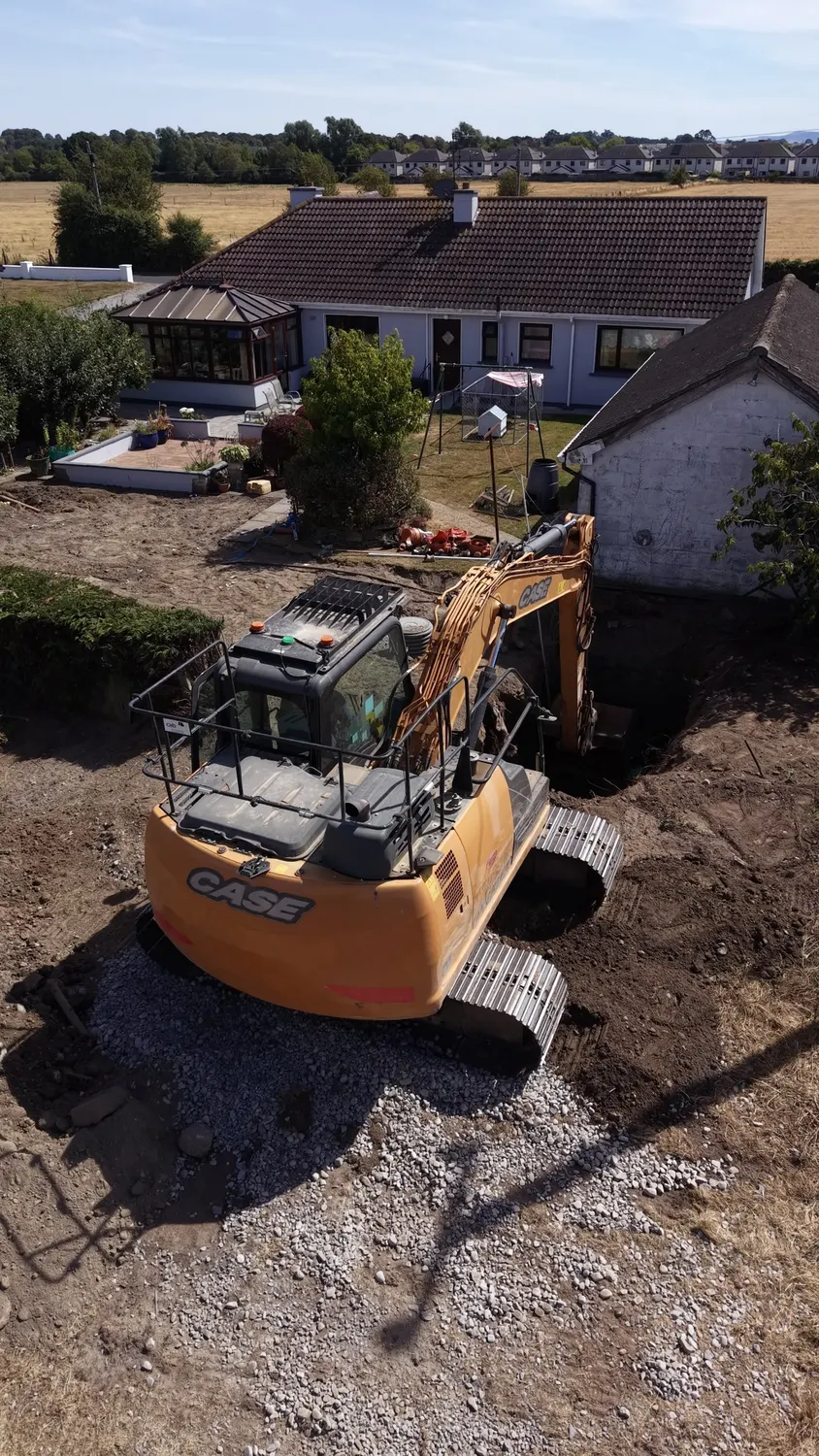 Aerial view of machines on a cleared garden plot